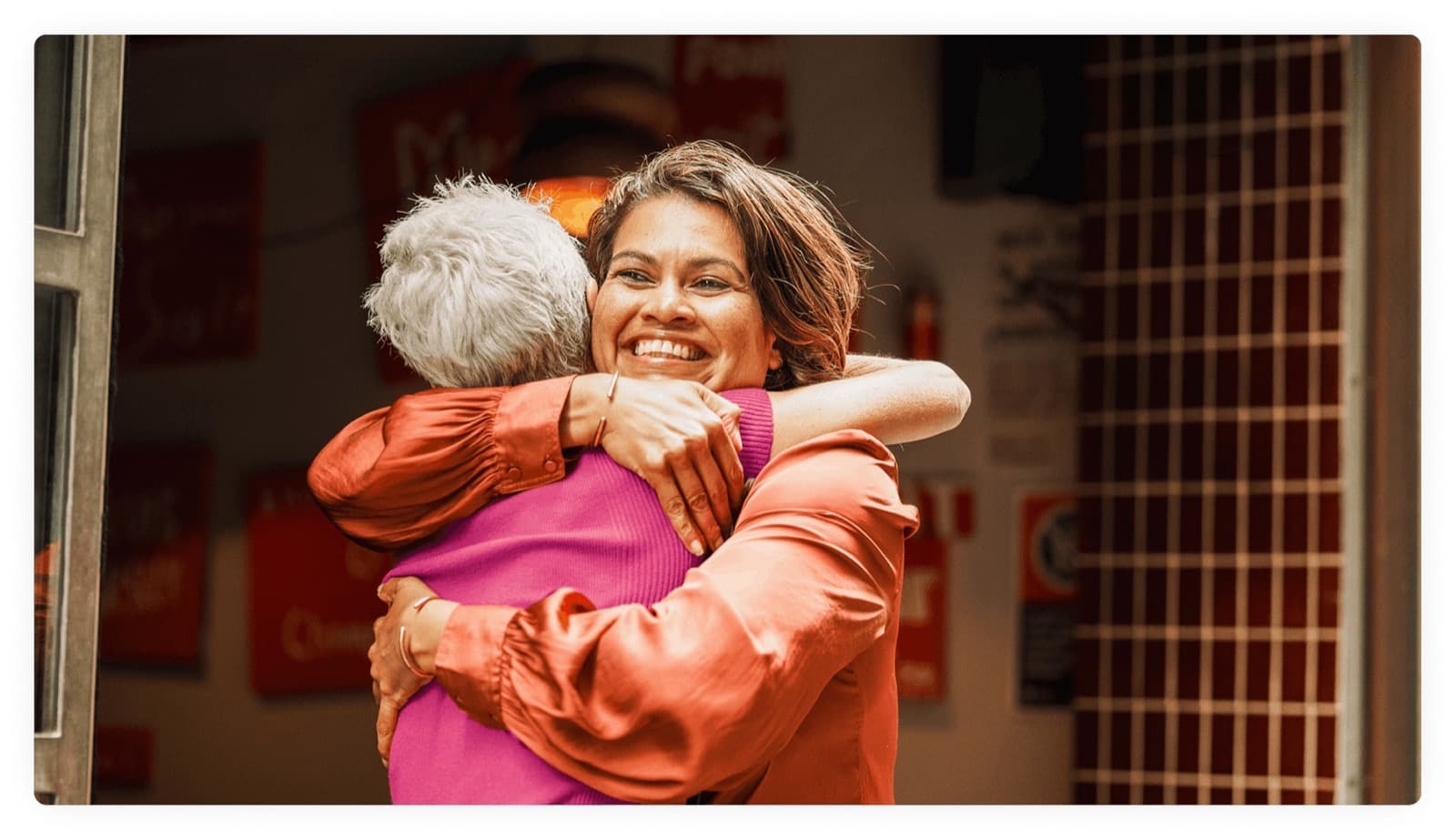 Two women hugging outside