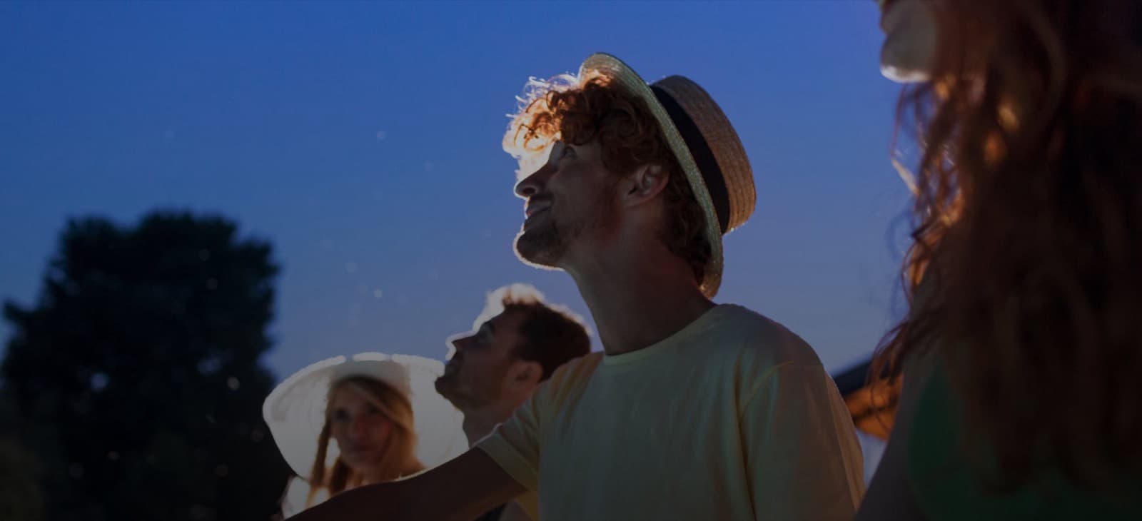 People looking up at the night sky