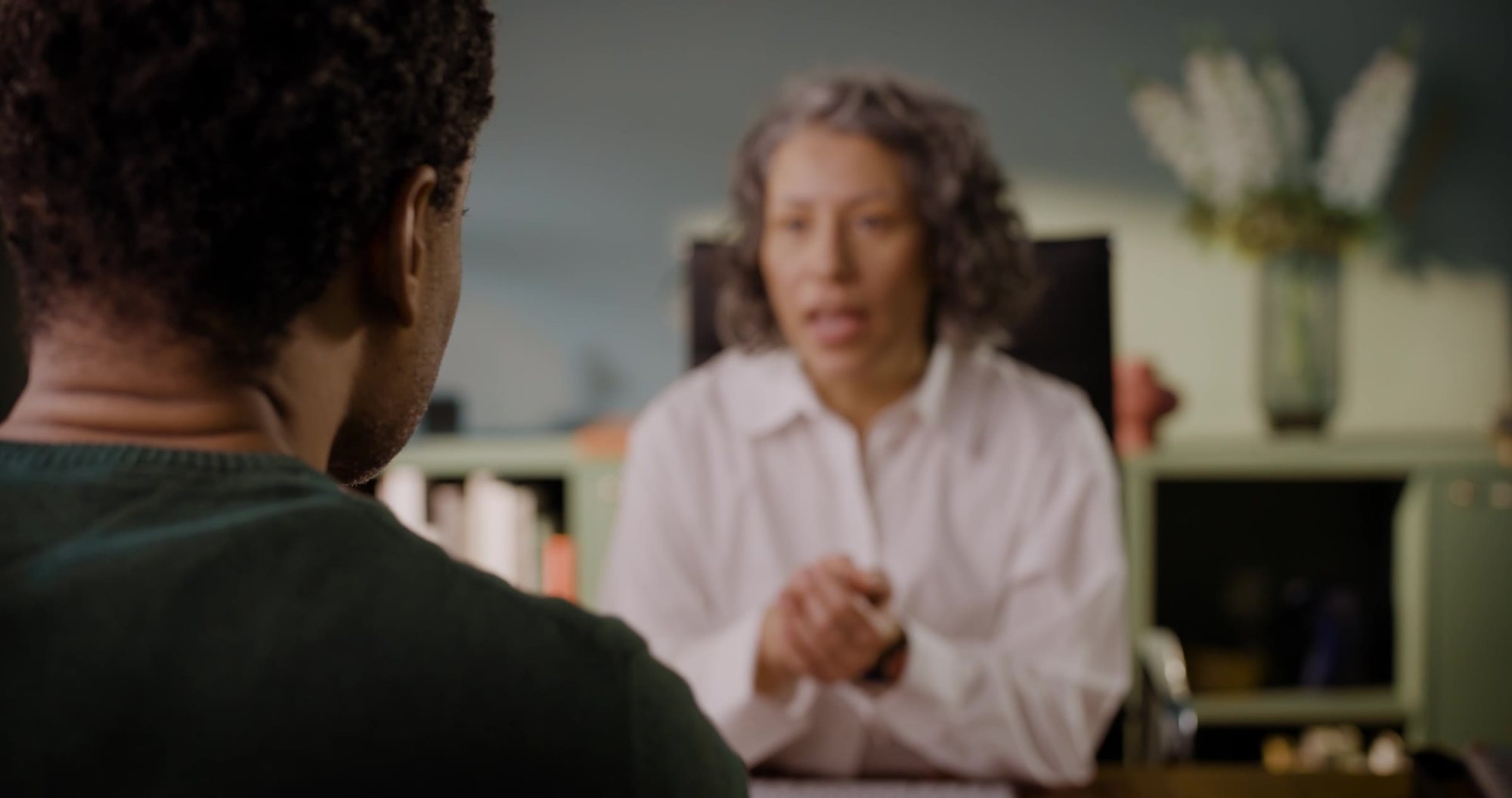 A hearing care professional in conversation with a client